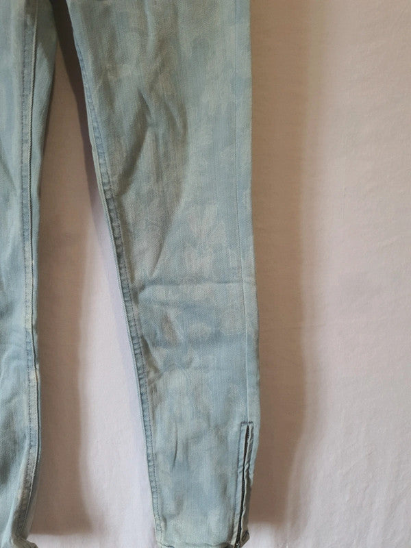 Jean skinny impression blanche avec fermeture éclair au jambes