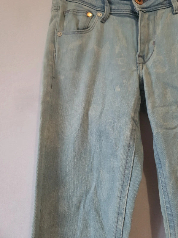 Jean skinny impression blanche avec fermeture éclair au jambes