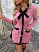 Elegant women's knitted dress with V-neck bow and textured pattern.