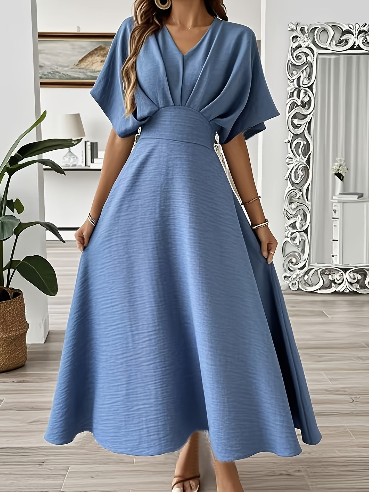 Robe longue élégante à manches chauve-souris