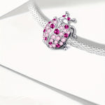 Charms coccinelle rose à pois en plaqué argent