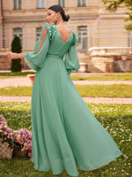 Robe longue élégante à manches bouffantes en dentelle
