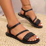 Comfortable summer sandals for women, featuring a minimalist style with a chic black design, braided straps, and cushioned sole for optimal comfort.