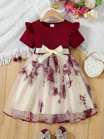 Elegant short-sleeved tutu dress with bow and mesh details for girls.