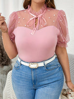 T-shirt élégant femme noir à pois blancs